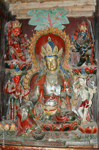 Ancient sacred statue of a deity with a silvery body in a Tibetan monastery