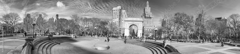 NEW YORK CITY - DECEMBER 6TH, 2018: Panoramic view of tourists along Washington Square Park. The city attracts 50 million tourists annually