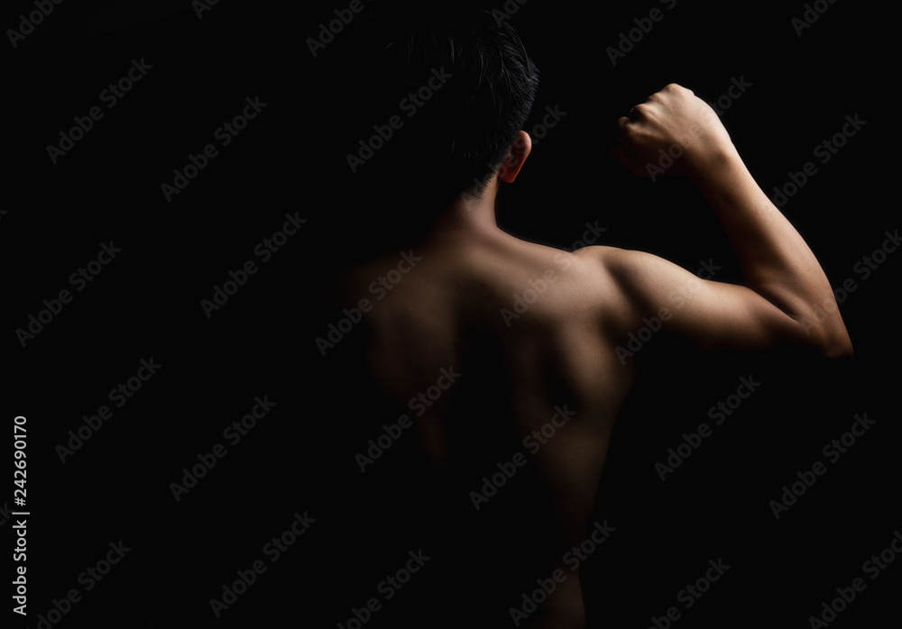 Backside a man strong show hand fight on black isolate Backside a man strong show hand fight on black isolate