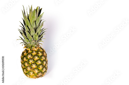 Ripe pineapple lie on a white background