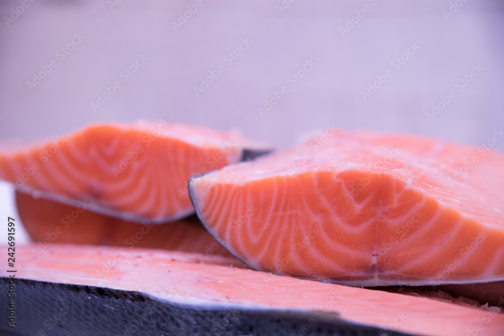 Fresh tasty salmon steaks close up ready for sale