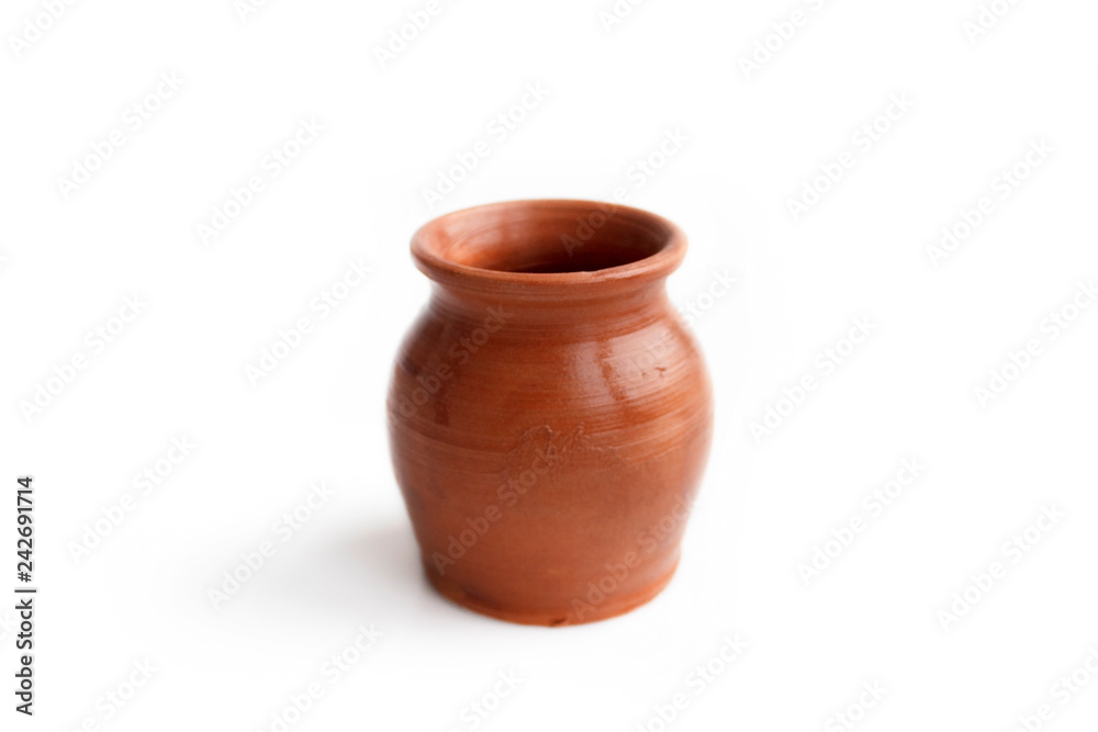 Clay pot, made by hand on a potter's wheel from red clay. Double burning. Transparent glaze applied by hand - visible potter's fingerprints and brush strokes. Handmade, single copy.  isolated
