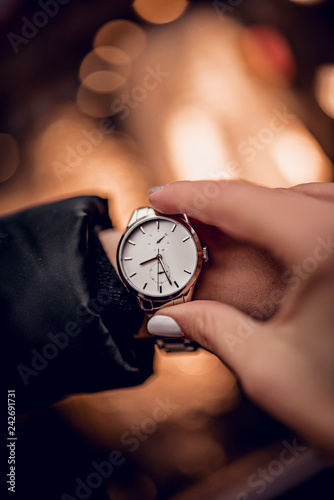 Beautiful silver watch on woman hand