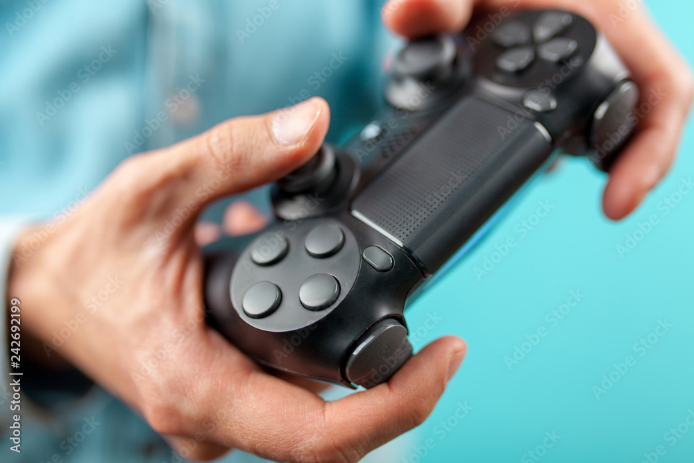 Male hands holding a gaming controller