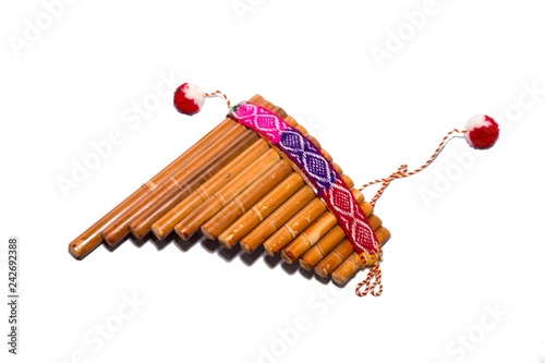 Flute - folk instrument from Peru and Bolivia. Close-up. Isolated on white background. photo
