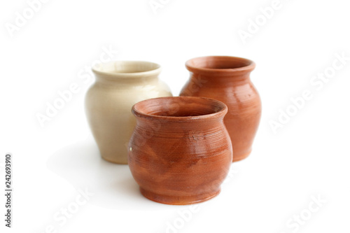 Clay pots, made by hand on a potter's wheel from red and white clay. Double burning. Transparent glaze applied by hand - visible potter's fingerprints and brush strokes. Handmade