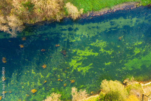 Croatia  Dobra river from air  top down view from drone  Karlovac county  green surface of clear water in autumn  beautiful nature