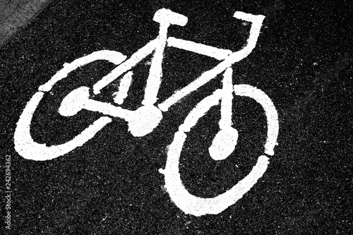 bicycle lane sign on asphalt road