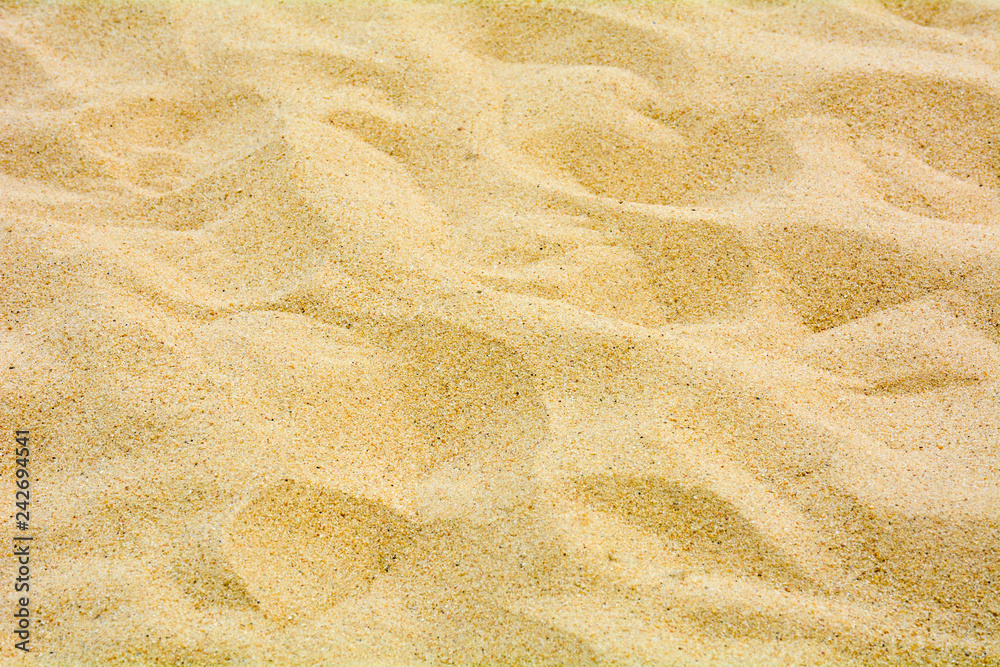 closeup of sand pattern of a beach in the summer