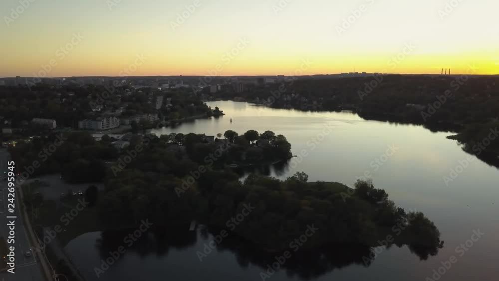Aerial panoramic view of a Highway in the Modern City during a vibrant Sunset. Taken in Halifax, Dartmouth, Nova Scotia, Canada.