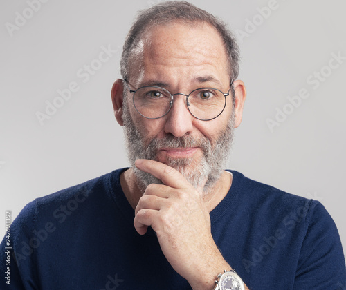 Portrait of a bearded mature adult casual Businessman looking into 