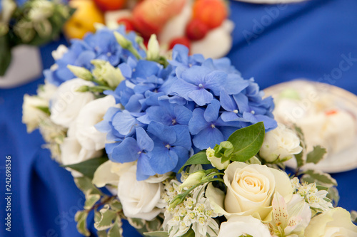 Blue hydrangea and white roses.