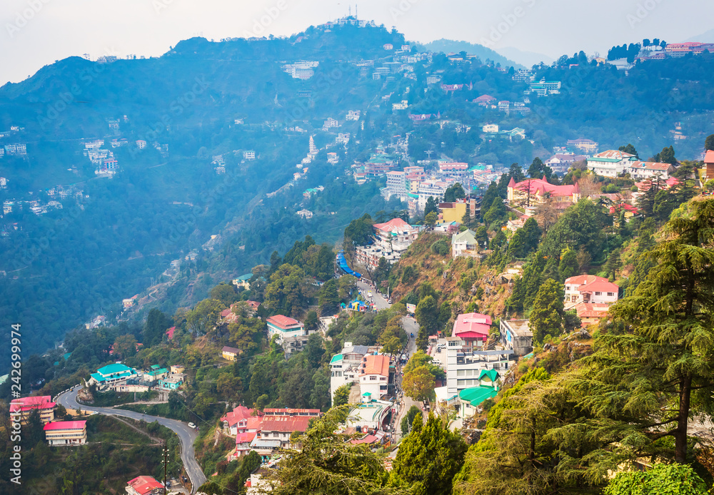 An Aerial landscape view of Mussoorie or Mussouri hill top peak city located in Uttarakhand India with colorful buildings