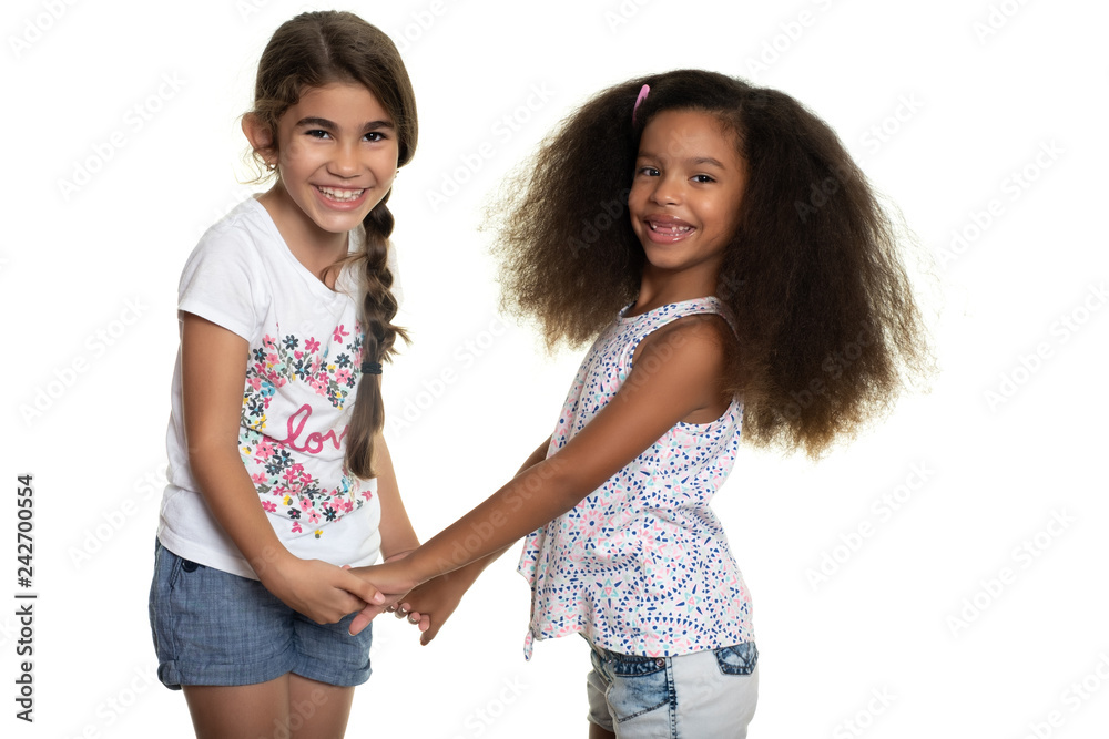 Cute hispanic and african-american small girls holding hands Cute hispanic and african-american small girls holding hands