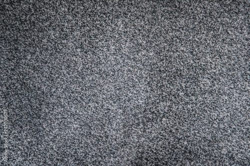 Polished speckled dark gray granite texture background
