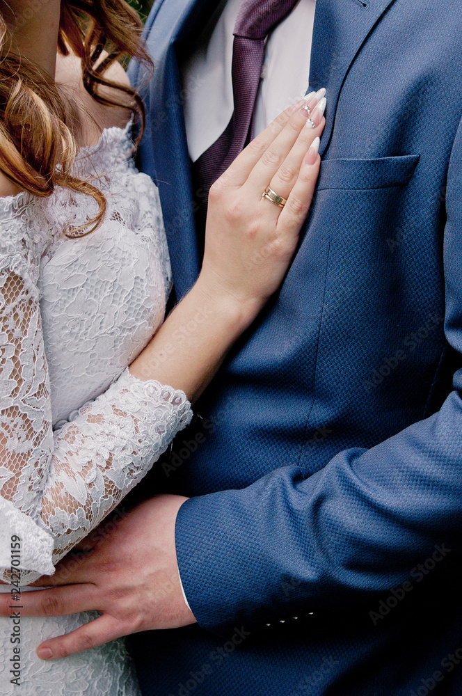 Lovers couple, man and woman, hugging, close-up. Valentine's Day, Wedding Day, love story or romantic background Lovers couple, man and woman, hugging, close-up. Valentine's Day, Wedding Day, love story or romantic background