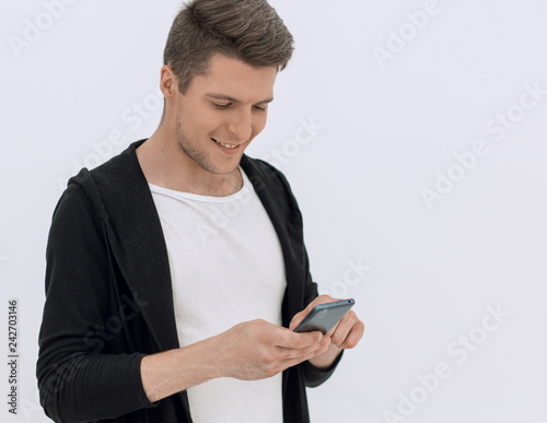 handsome guy looking at the smartphone screen