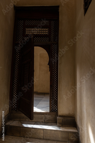 Interior door with mashrabiya motifs at Bayt Al-Suhaymi, House of Suhaymi, is an old Ottoman era house museum in islamic Cairo, Egypt photo