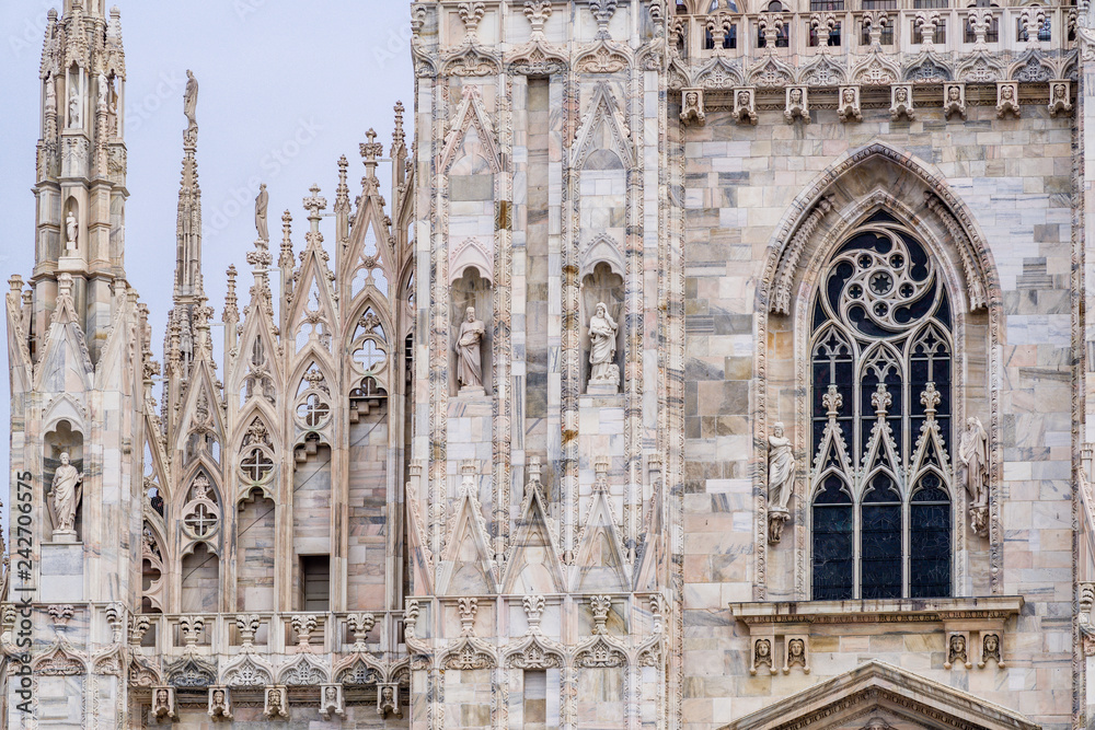 Exterior Duomo di Milano, spires statues, windows marbel, 