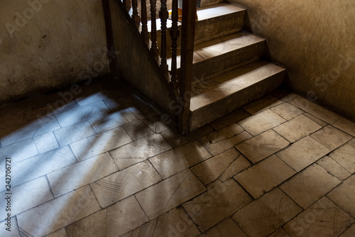 Thema image of steps on staircase with mysterious light photo