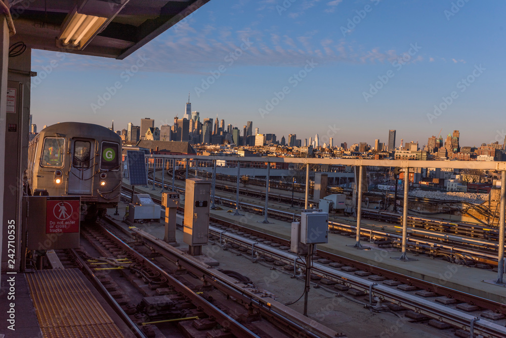 elevated train pulls into subway station