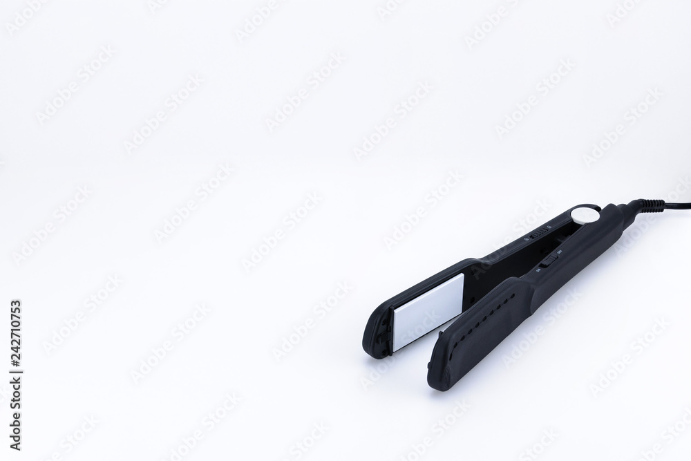 Grey hair iron on the white background with copy space. Grey hair iron on the white background with copy space.