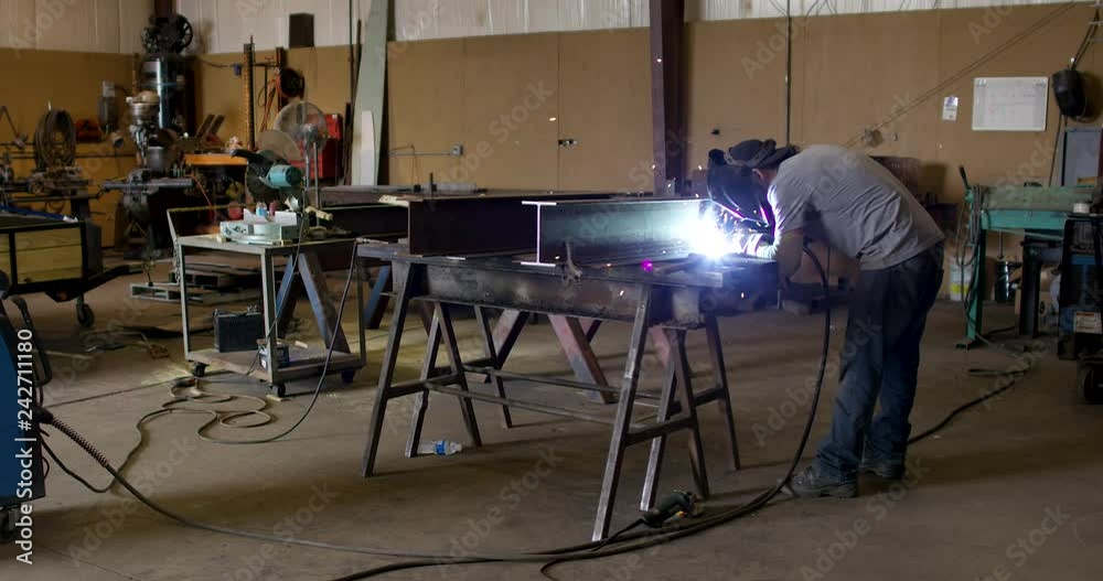 Worker Welding In Machine Shop Wide Worker Welding In Machine Shop Wide