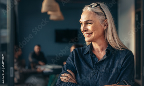 Female entrepreneur standing in office