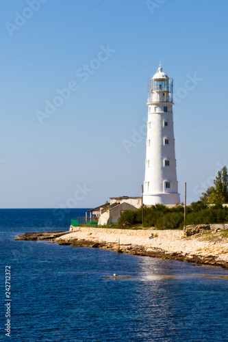 old lighthouse by the sea © Alexey