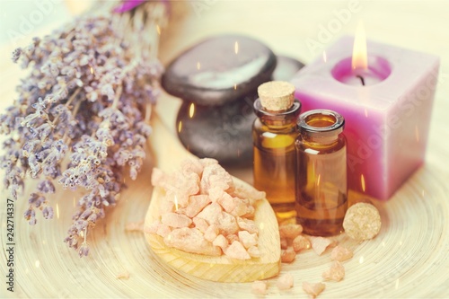 Pile of lavender flowers and a dropper bottle with lavender