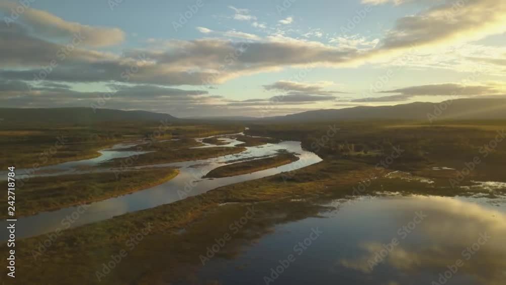 Aerial landscape view of a beautiful river during a sunny sunrise. Taken in Codroy Valley, Newfoundland, Canada. Aerial landscape view of a beautiful river during a sunny sunrise. Taken in Codroy Valley, Newfoundland, Canada.