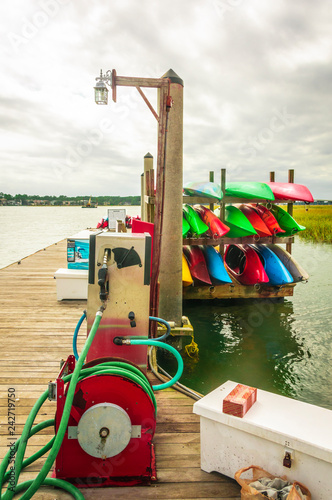 Colorful kayaks and a gas pump for marine vessels at Hilton Head Island dock