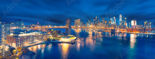a magnificent view of the lower Manhattan and Brooklyn Bridge