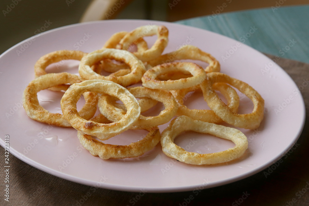 Fried squid rings in plate. Snack calamari rings. Fried squid rings in plate. Snack calamari rings.