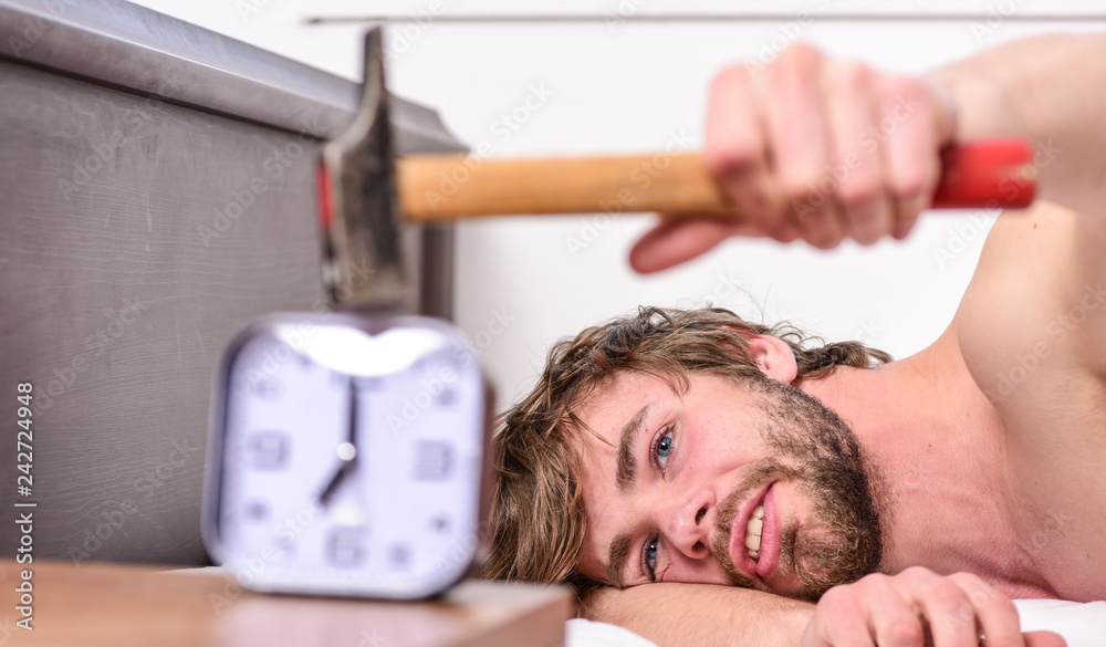 Foto de Stop ringing. Annoying ringing alarm clock. Man bearded annoyed