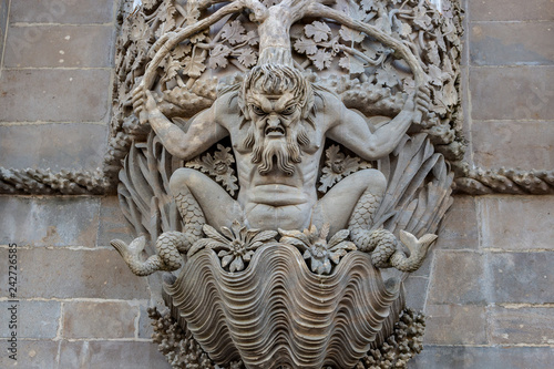 Triton over the lancet arch, Pena National Palace, Romanticist palace in Sintra photo