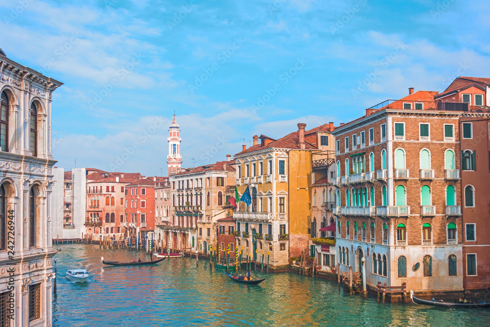 View of the street canal in Venice, colorful facades of old houses.