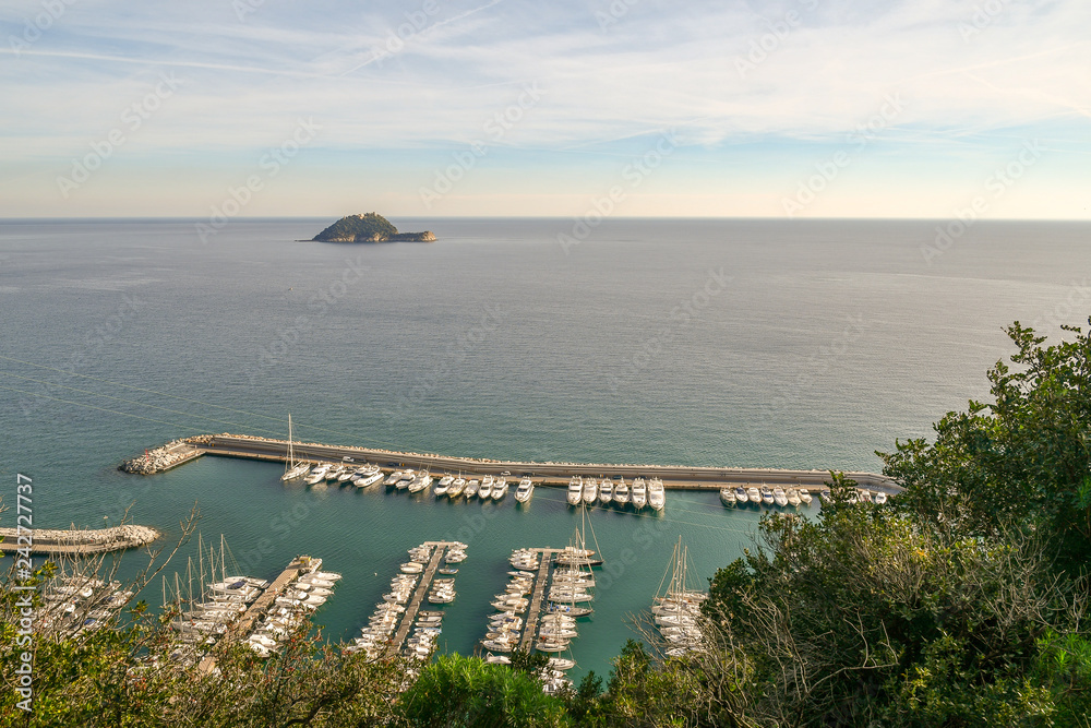 Panoramic view from above of the harbor of Alassio and the Gallinara Island, Liguria, Italy