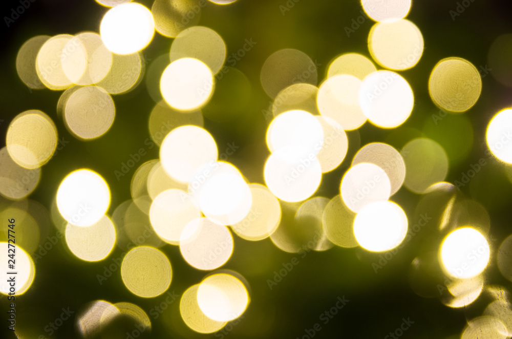 Obraz premium yellow Christmas lights in defocus; christmas background