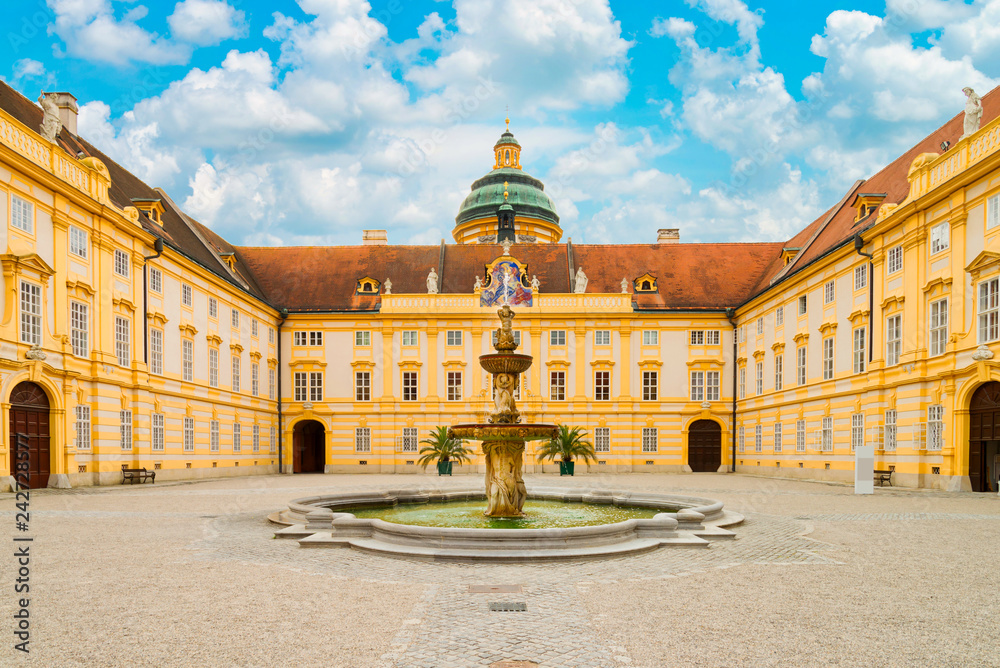 The main courtyard of historic Melk Abbey and blue sky in summer, Austria