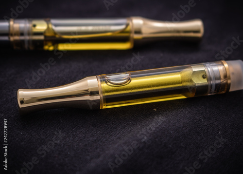 THC/CBD Cannabis Oil & Terpenes Filled Cartridges Isolated Up Close On Black
