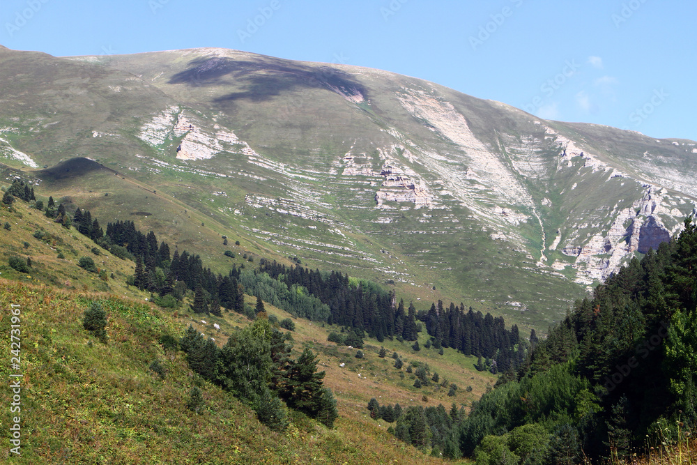Fototapeta premium Photo of nature - fantastic rocky mountain cliff with bright blue sky