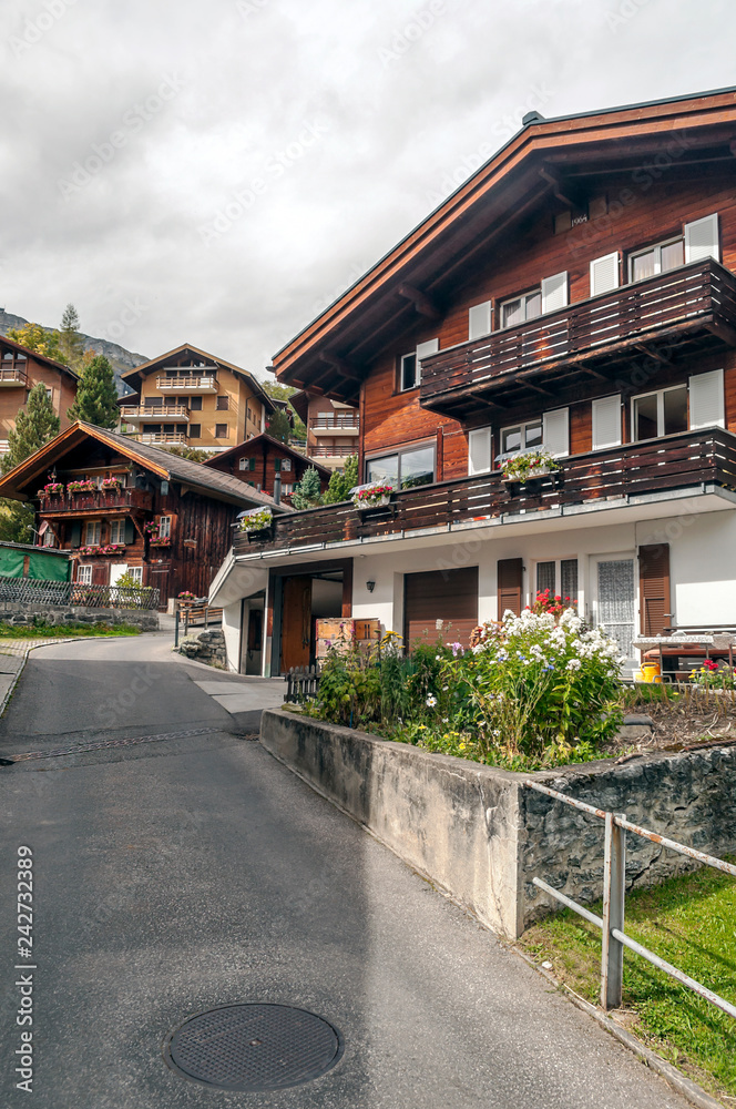 Wooden houses in the Murren mountains in Switzerland on a cloudy day