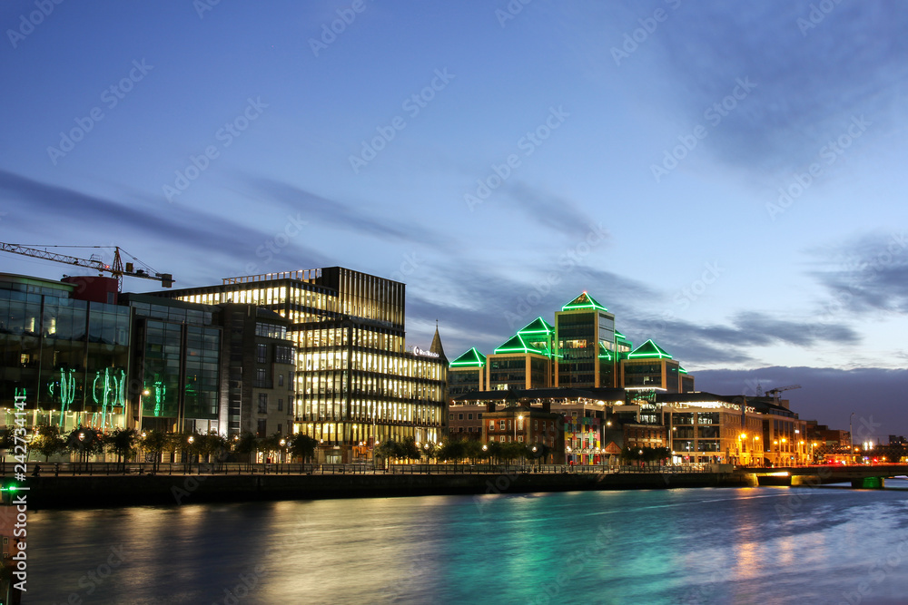 City Center with business quarter at the late sunset time on the river Liffey in Dublin, Ireland