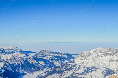 White and blue Alps in Switzerland during winter
