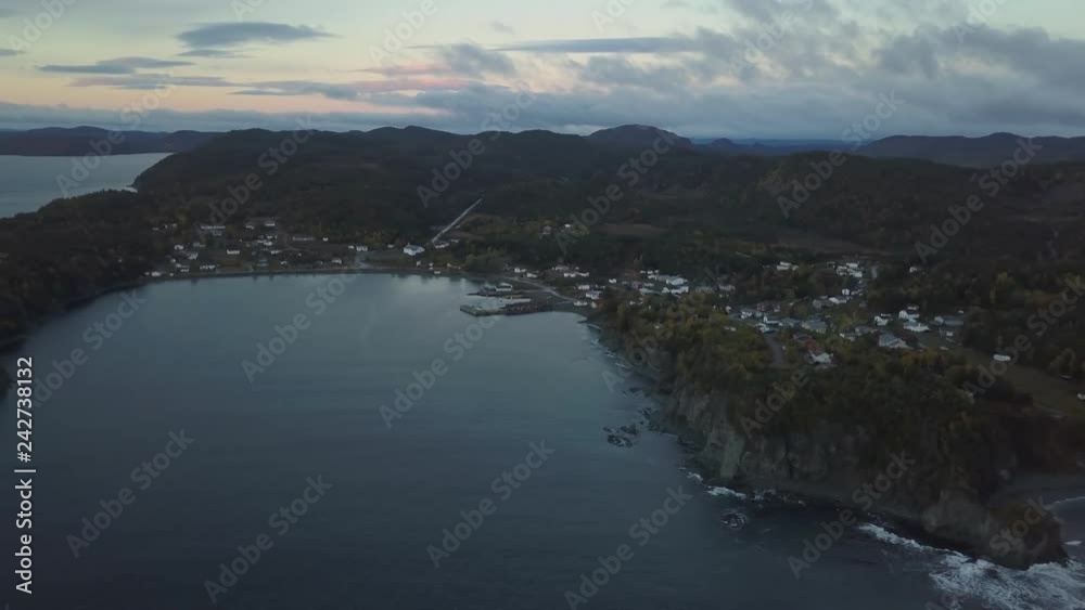 Aerial Canadian Landscape View by the Atlantic Ocean Coast during a cloudy sunrise. Taken in Beachside, Newfoundland, Canada. Aerial Canadian Landscape View by the Atlantic Ocean Coast during a cloudy sunrise. Taken in Beachside, Newfoundland, Canada.