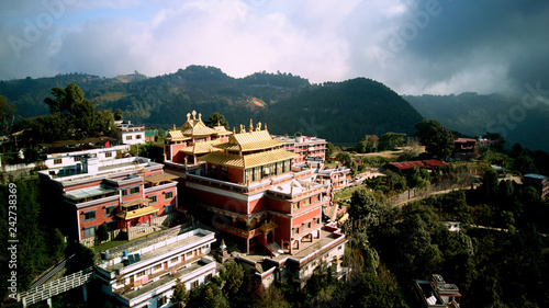 Ancient buddhist monastery in Himalayas Nepal from air photo