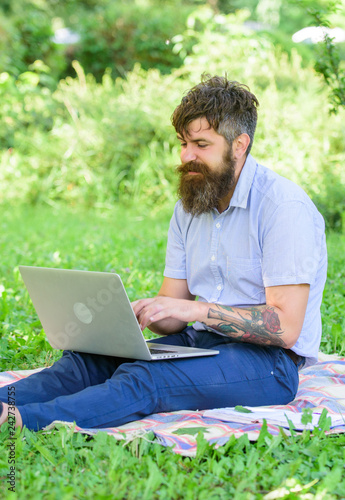 Blogger create content for social network. Writer or blogger write post for social network. Inspiration for blogging. Blogger becoming inspired by nature. Man bearded with laptop nature background