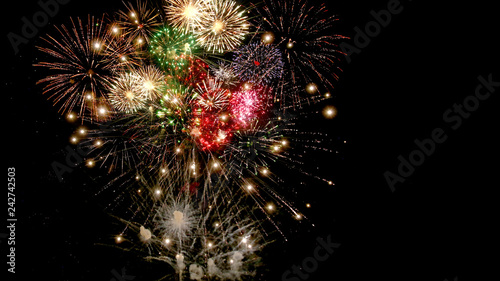 Beautiful colorful fireworks  for celebration on dark background , New year holiday concept