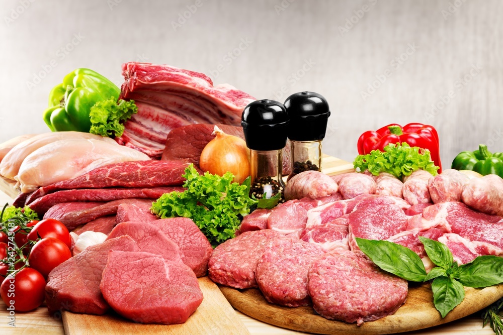 Fresh Raw Meat Background with vegetables Fresh Raw Meat Background with vegetables